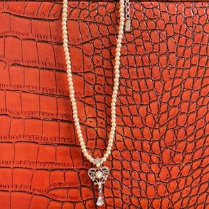 1928 faux pearl necklace with crown pendant